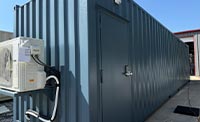 Modified Shipping container with front door with a keypad lock and an air conditioner