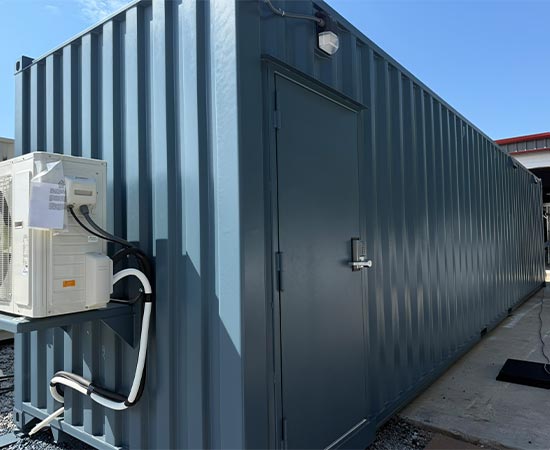 Modified Shipping container with front door with a keypad lock and an air conditioner