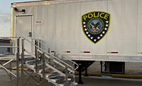 White mobile container structure labeled police badge of US Department of Veterans Affairs